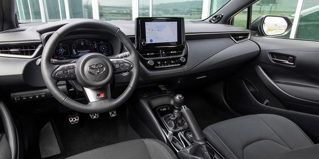 The GR Corolla has sports seats and a leather steering wheel.