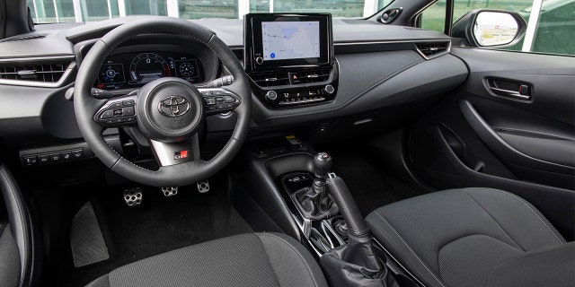 The GR Corolla has sports seats and a leather steering wheel.