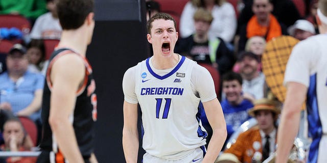 Ryan Kalkbrenner #11 of the Creighton Bluejays reacts after dunking against Zach Martini #54 of the Princeton Tigers during the first half in the Sweet 16 round of the NCAA Men's Basketball Tournament at KFC YUM! Center on March 24, 2023, in Louisville, Kentucky. 