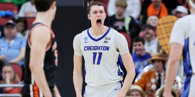 Ryan Kalkbrenner #11 of the Creighton Bluejays reacts after dunking against Zach Martini #54 of the Princeton Tigers during the first half in the Sweet 16 round of the NCAA Men's Basketball Tournament at KFC YUM! Center on March 24, 2023, in Louisville, Kentucky. 