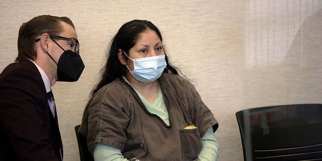 Yesenia Guadalupe Ramirez, center, one of two suspects charged in connection with the kidnapping of a 3-month-old baby, appears for her arraignment hearing on April 28, 2022.