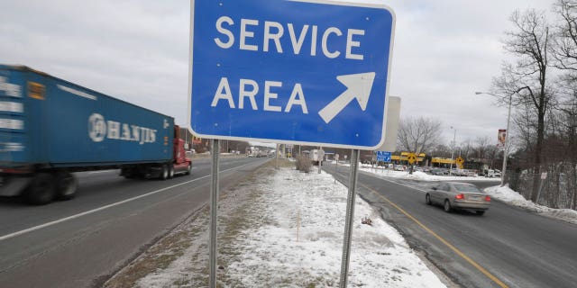 Connecticut's labor commissioner is suing the operator of the state's 23 highway rest stops for wages owed to restaurant employees.