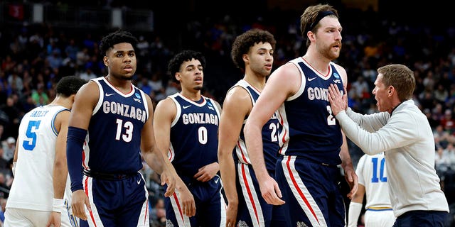 Drew Timme #2, Anton Watson #22, Julian Strawther #0 and Malachi Smith #13 of the Gonzaga Bulldogs react after a timeout called during the second half against the UCLA Bruins in the Sweet 16 round of the NCAA Men's Basketball Tournament at T-Mobile Arena on March 23, 2023 in Las Vegas, Nevada. 