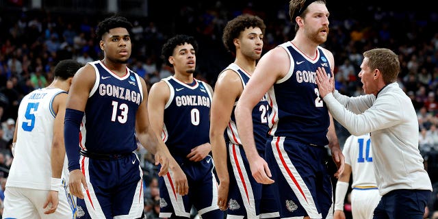 Drew Timme #2, Anton Watson #22, Julian Strawther #0 and Malachi Smith #13 of the Gonzaga Bulldogs react after a timeout called during the second half against the UCLA Bruins in the Sweet 16 round of the NCAA Men's Basketball Tournament at T-Mobile Arena on March 23, 2023 in Las Vegas, Nevada.