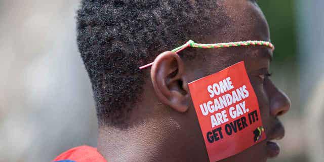 A Ugandan man is seen during the third annual Lesbian, Gay, Bisexual and Transgender Pride celebrations in Uganda, on Aug. 9, 2014. Ugandan lawmakers passed a bill on March 21, 2023, prescribing jail terms for offenses related to same-sex relations.