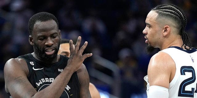 Draymond Green, #23 of the Golden State Warriors, and Dillon Brooks, #24 of the Memphis Grizzlies, exchange words with each other during the second quarter at the Chase Center on December 25, 2022, in San Francisco, California. 
