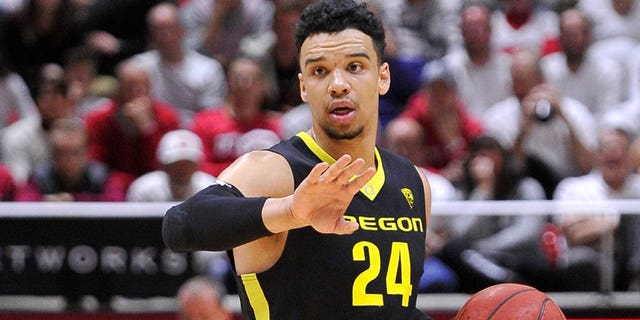 Dillon Brooks of the Oregon Ducks directs a play against the Utah Utes at the Jon M. Huntsman Center on January 14, 2016 in Salt Lake City.