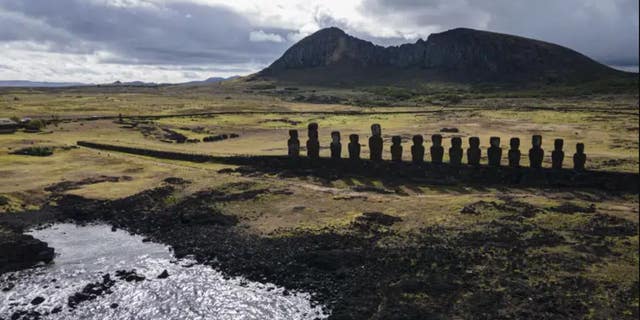 Moai statues are found on Ahu Tongariki near the Rano Raraku volcano, high up, in Rapa Nui, or Easter Island, Chile, November 27, 2022. According to Salvador Atan Hito, vice president of the Ma'u Henua indigenous community which administers the archaeological treasure of Rapa Nui, March 1, 2023, a small moai was recently discovered in the middle of a dry lagoon inside the crater of the volcano. 