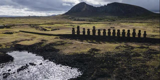 Moai statues are found on Ahu Tongariki near the Rano Raraku volcano, high up, in Rapa Nui, or Easter Island, Chile, November 27, 2022. According to Salvador Atan Hito, vice president of the Ma'u Henua indigenous community which administers the archaeological treasure of Rapa Nui, March 1, 2023, a small moai was recently discovered in the middle of a dry lagoon inside the crater of the volcano. 