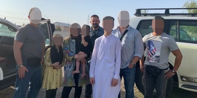 Cory Mills with the American family evacuated from Afghanistan during the chaotic U.S. withdrawal.
