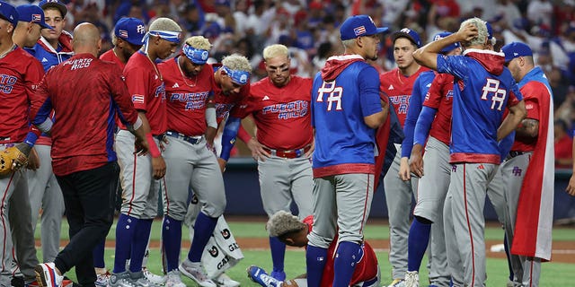 Edwin Diaz #39 of Team Puerto Rico lies hurt on the field after celebrating a 5-2 win against Team Dominican Republic during their World Baseball Classic Pool D game at loanDepot park on March 15, 2023, in Miami, Florida.
