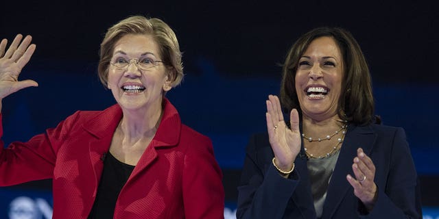 Massachusetts Sen. Elizabeth Warren, left, stands alongside Vice President Kamala Harris at a dinner nearly a month after the senator failed to endorse a 2024 Biden-Harris ticket.