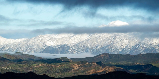 Snow capped mountains surround the Santa Clarita Valley in Santa Clarita, Calif., Tuesday, Feb. 28, 2023, after weekend storms. 