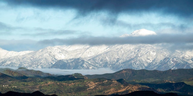 Snow capped mountains surround the Santa Clarita Valley in Santa Clarita, Calif., Tuesday, Feb. 28, 2023, after weekend storms.