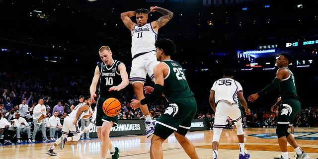 Kansas State forward Keyontae Johnson (11) drives during the second half of the Sweet 16 college basketball game against Michigan State in the East Regional of the NCAA tournament at Madison Square Garden, Thursday, March 23, 2023, in New York.