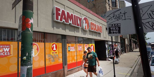 Pedestrians walk past a Family Dollar store in Chicago, Illinois.