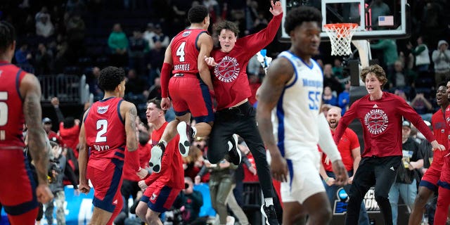 Florida Atlantic players celebrate their 66-65 win against the Memphis Tigers after a first-round college basketball game in the NCAA Tournament Friday, March 17, 2023, in Columbus, Ohio.
