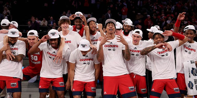 The Florida Atlantic Owls celebrate after defeating the Kansas State Wildcats in the Elite Eight of the NCAA Tournament at Madison Square Garden March 25, 2023, in New York City.