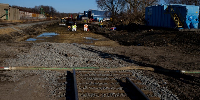 Ohio EPA and EPA contractors collect soil and air samples from the derailment site on March 9, 2023, in East Palestine, Ohio. 