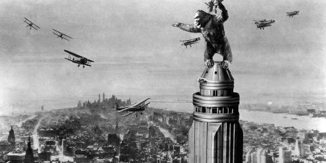 The giant ape fights off planes atop the Empire State Building in New York City at the end of the film "King Kong," 1933. 