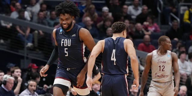 Ansley Almonor, #5 of the Fairleigh Dickinson Knights, celebrates after his made basket with Grant Singleton #4 against the Texas Southern Tigers during the second half in the First Four game of the NCAA Men's Basketball Tournament at University of Dayton Arena on March 15, 2023, in Dayton, Ohio.