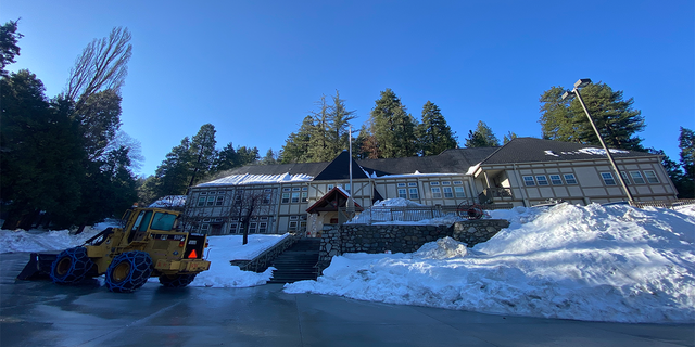 The San Bernardino County Fire Department used a fleet of eight snowcats during the worst of the storm. Fire Station No. 91 in Lake Arrowhead, CA, is still surrounded by snow drifts on March 15, 2023, three weeks since the blizzard.
