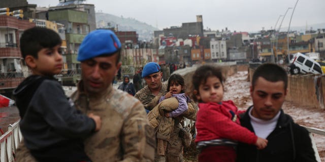 People are being rescued after heavy rains flooded the area in Sanliurfa, Turkey, on March 15, 2023.