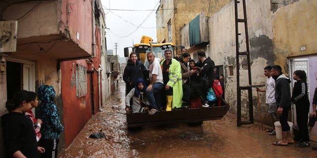 People are rescued during floods after heavy rain in Sanliurfa, Turkey on March 15, 2023. 