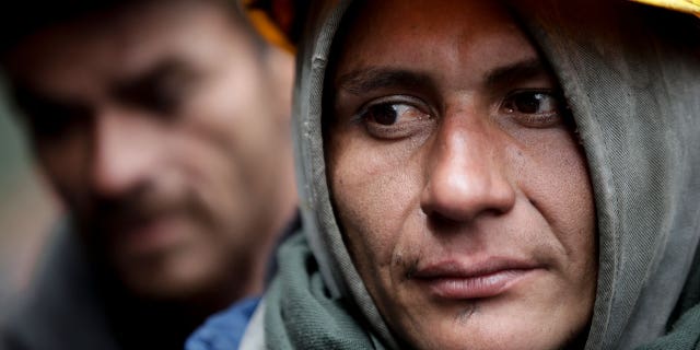 Miners wait for news of fellow workers after an explosion at a coal mine that according to authorities killed at least 11 people in Sutatausa, Cundinamarca department, Colombia, on March 15, 2023.