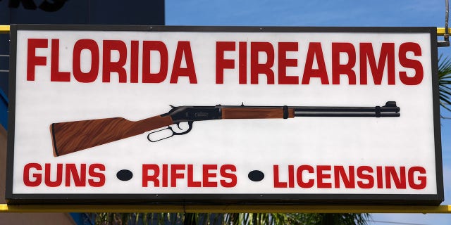 A sign for a gun shop in Miami, Florida.