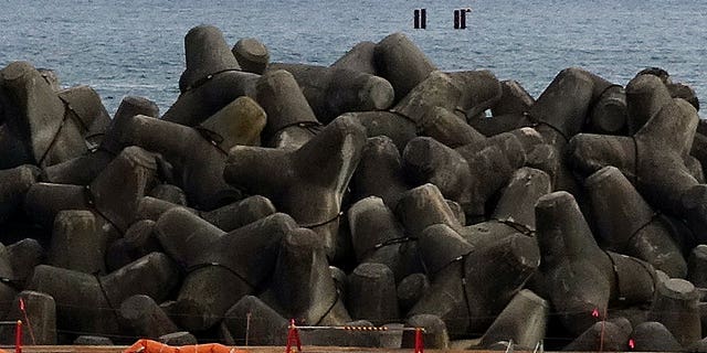 Four pillars located in the ocean near the tsunami-destroyed Fukushima Daiichi Nuclear Power Plant indicate an underwater tunnel where treated radioactive wastewater would be released.