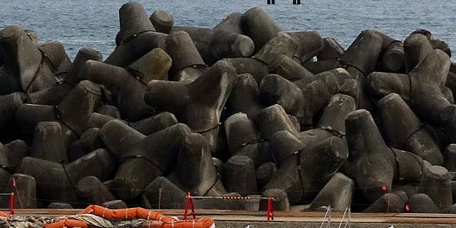 Four pillars located in the ocean near the tsunami-destroyed Fukushima Daiichi Nuclear Power Plant indicate an underwater tunnel where treated radioactive wastewater would be released.