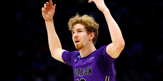 ORLANDO, FLORIDA - MARCH 16: Garrett Hien #13 of the Furman Paladins reacts against the Virginia Cavaliers during the second half of the first round of the NCAA Men's Basketball Tournament at the Amway Center on March 16, 2023 in Orlando, Florida. 