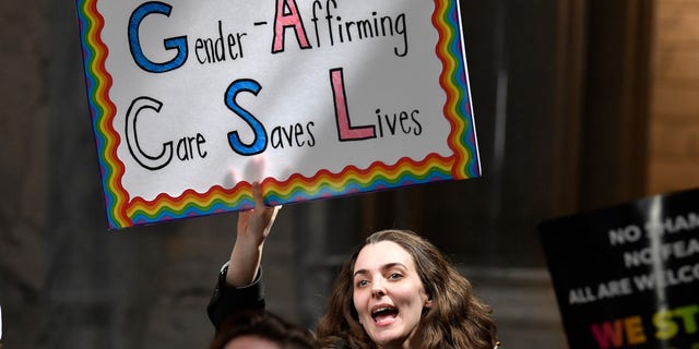 A protester shows her opposition to Kentucky Senate bill SB150, known as the Transgender Health Bill outside the Senate chamber at the Kentucky State Capitol in Frankfort, Ky., Wednesday, March 29, 2023.