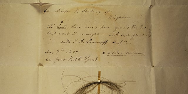 The Stumpff Lock from which Beethoven’s high-coverage genome was sequenced. The lock is affixed to a letter from Johann Andreas Stumpff to Patrick Stirling, dated May 7, 1827. Stumpff’s poem reads, "The head, these hair’s have grac’d lies low; But what it wrought — will ever grow."