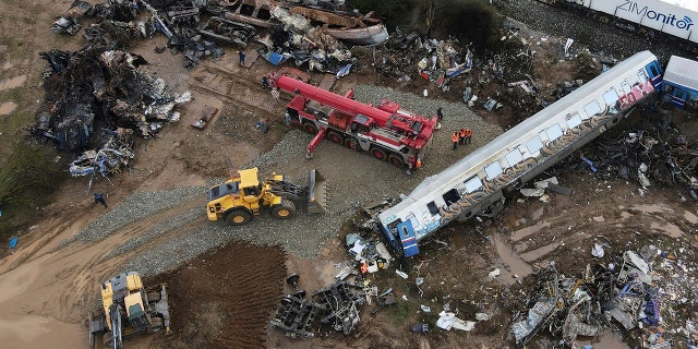 The wreckage of the trains lie next to the rail lines, after Tuesday's rail crash, the country's deadliest on record, in Tempe, about 235 miles north of Athens, near Larissa city, Greece, on Friday.