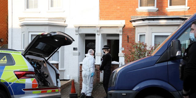 Police forensic officers at the house in Moore Street in Kingsley, Northampton, March 20, 2022.
