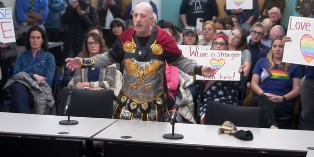 A Concord, New Hampshire father who was banned from occupying an elementary school’s property dressed up as Julius Caesar at a recent school board meeting on Monday to drive his claims that a public school district is "facilitating gender confusion."