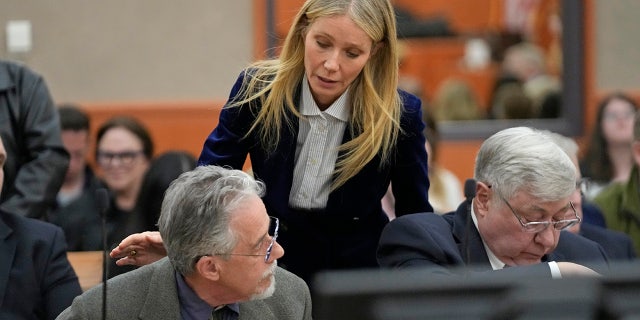 Gwyneth Paltrow speaks with retired optometrist Terry Sanderson,left, as she walks out of the courtroom following the reading of the verdict in their lawsuit trial.