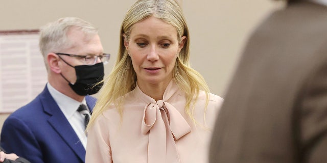 Gwyneth Paltrow wears a pink blouse from her Goop collection to court on Tuesday.