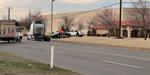 Police outside the Hobby Lobby distribution center in Oklahoma City after an employee shot, killed a manager.