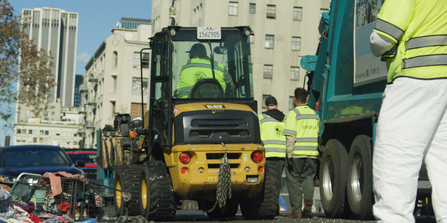 The City of Los Angeles uses a bulldozer to remove a homeless encampment. 