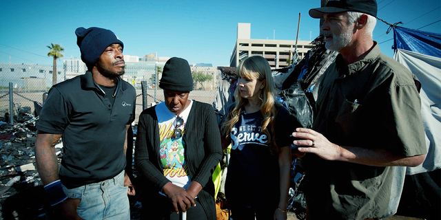 Producer Robert Craig speaks with Aisha and James, a husband and wife experiencing homelessness in Phoenix, Arizona. 