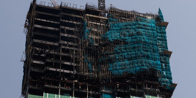 An under-construction skyscraper is seen after a blaze is put out at Tsim Sha Tsui in Hong Kong March 3, 2023.