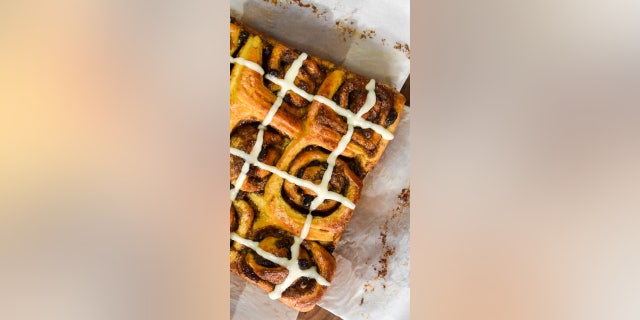 Reinvent classic hot cross buns for your Easter celebration with this hot cross bun cinnamon roll recipe.