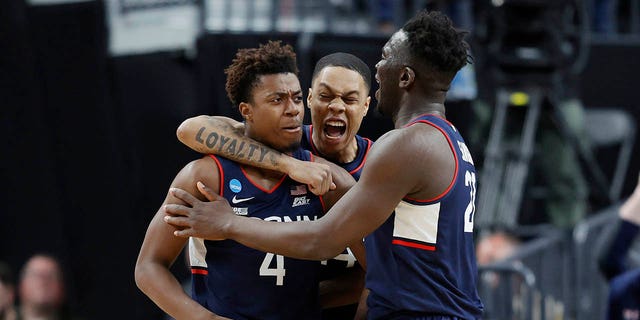 Nahiem Alleyne #4 of the Connecticut Huskies celebrates with teammates after scoring during the second half against the Gonzaga Bulldogs in the Elite Eight round of the NCAA Men's Basketball Tournament at T-Mobile Arena on March 25, 2023 in Las Vegas, Nevada.