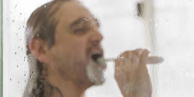 Some people prefer to brush their teeth in showers instead of brushing their teeth over sinks because they find it convenient.