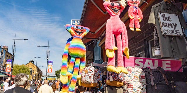 Huggy Wuggy toys are shown for sale on Camden High Street in Camden, London.