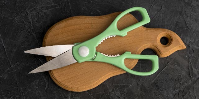 Kitchen shears are a type of sharp scissors that are used to cut food and crack nuts.