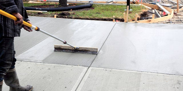 The Redditor said that a new walkway was in the process of being poured (not pictured) when some neighborhood kids decided to interfere with it.